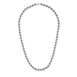 A HEMATITE BEAD NECKLACE comprising a row of alternating hematite and gold beads, stamped 14KT, 6...