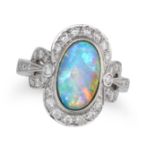 AN OPAL AND DIAMOND DRESS RING set with an oval cabochon opal in a border of round brilliant cut ...