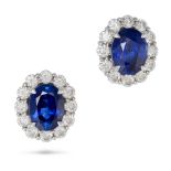 A PAIR OF SAPPHIRE AND DIAMOND CLUSTER EARRINGS each set with an oval cut sapphire of 4.56 and 4....