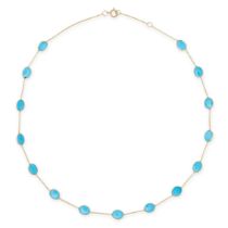 A TURQUOISE CHAIN NECKLACE comprising a trace chain set with fifteen oval cabochon turquoise, sta...