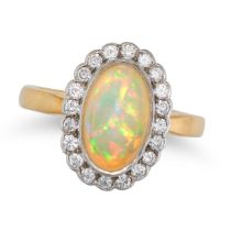 AN OPAL AND DIAMOND CLUSTER RING in 18ct yellow gold, set with an oval cabochon opal in a cluster...