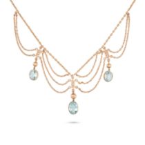 AN AQUAMARINE AND PEARL SWAG NECKLACE in yellow gold, comprising a trace chain suspending three o...