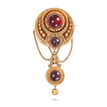 AN ANTIQUE GARNET BROOCH in yellow gold, the circular brooch set with two round cabochon garnets,...