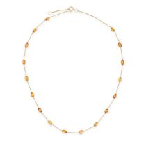 A YELLOW AND ORANGE SAPPHIRE CHAIN NECKLACE the trace chain set with a row of oval cut yellow and...
