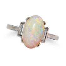 AN OPAL AND DIAMOND RING set with an oval cabochon opal accented on each side by a baguette cut d...