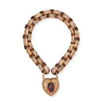 AN ANTIQUE GARNET HEART PADLOCK BRACELET in yellow and rose gold, the textured curb chain suspend...