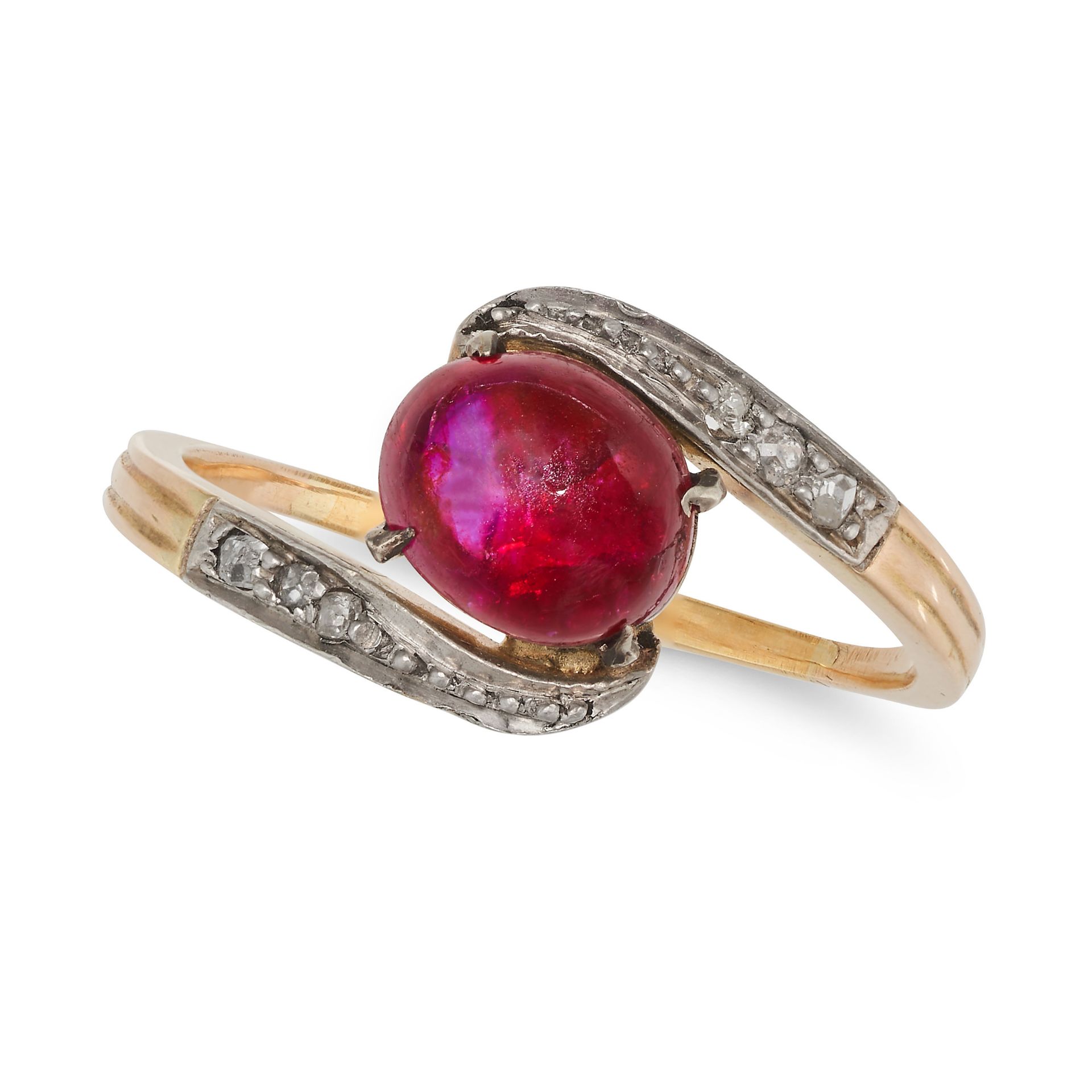 AN ANTIQUE RUBY AND DIAMOND RING in yellow gold and silver, set with an oval cabochon ruby of app...