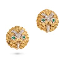 A PAIR OF EMERALD AND DIAMOND OWL EARRINGS each designed as the head of an owl accented by single...