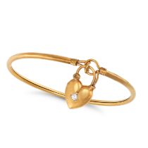 A DIAMOND HEART PADLOCK BANGLE the bangle with a heart shaped padlock clasp set with a round bril...