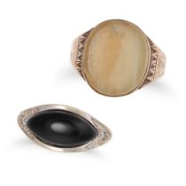 TWO GEMSET RINGS comprisng an onyx and diamond ring set with a navette shaped cabochon onyx accen...