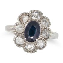 A SAPPHIRE AND DIAMOND CLUSTER RING set with an oval cut sapphire in a cluster of rose cut diamon...