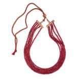 NO RESERVE - A DYED RED QUARTZ BEAD NECKLACE comprising five strands of faceted red quartz beads,...