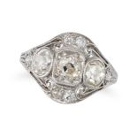 A DIAMOND DRESS RING set with three old cut diamonds accented by further old cut diamonds, the di...