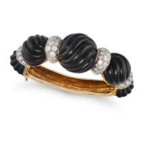 AN ONYX AND DIAMOND BANGLE the hinged bangle get with sections of carved onyx, accented by round ...
