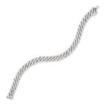 A DIAMOND CURB CHAIN BRACELET comprising a row of curb links set throughout with round brilliant ...