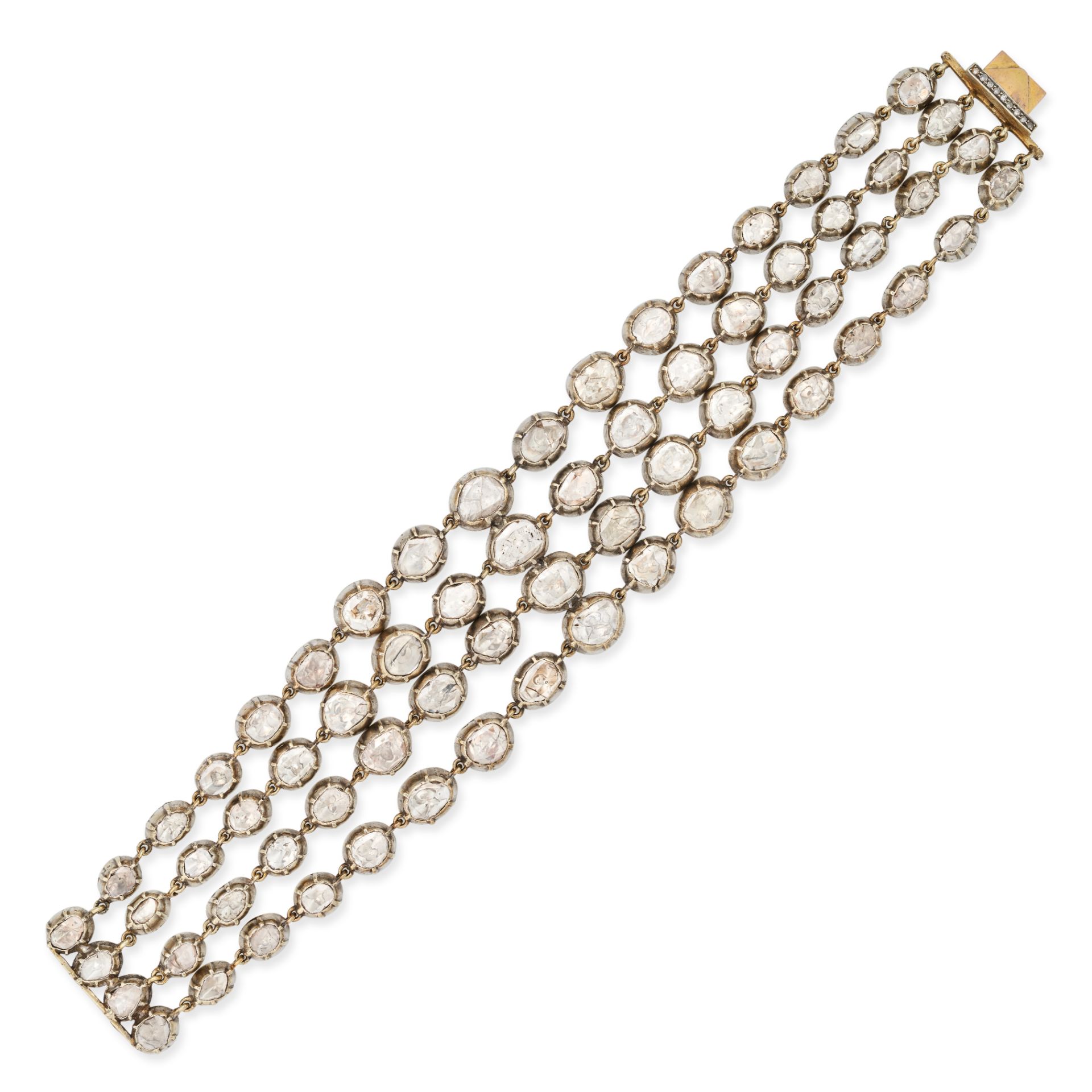 A POLKI DIAMOND BRACELET comprising four rows of graduated links set with polki cut diamonds, no ...