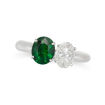 A TSAVORITE GARNET AND DIAMOND TOI ET MOI RING the band set with an oval cut tsavorite garnet of ...