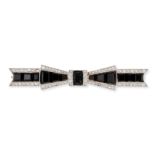 AN ONYX AND DIAMOND BOW BROOCH designed as a bow set with calibre cut onyx accented by rose cut d...