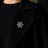 AN ANTIQUE DIAMOND SNOWFLAKE BROOCH / PENDANT later rhodium plated, set to the centre with an old...