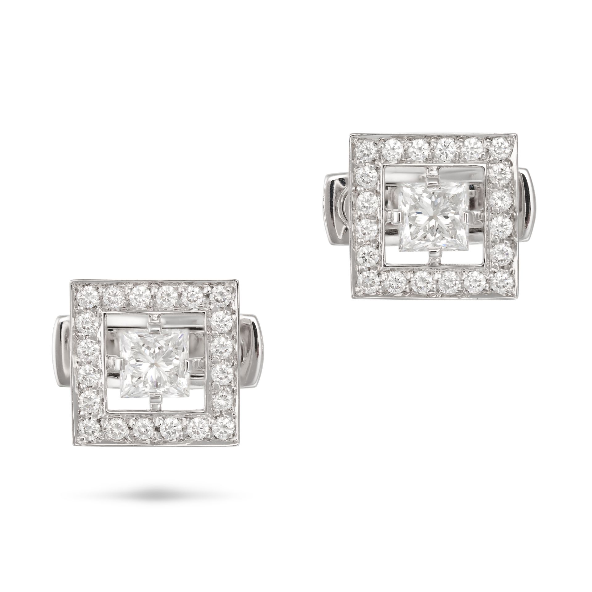 BOUCHERON, A PAIR OF DIAMOND CUFFLINKS in 18ct white gold, each set with a princess cut diamond i...