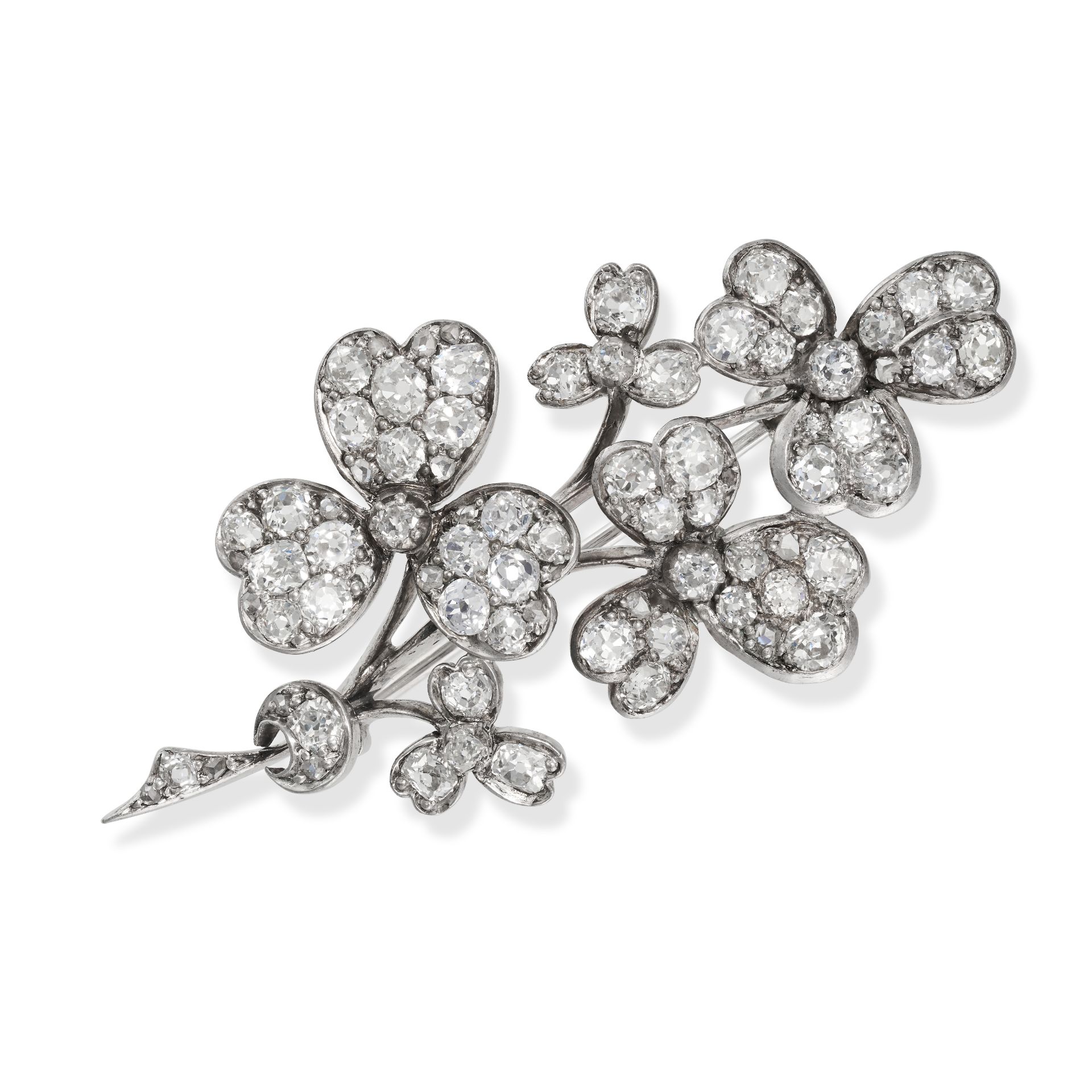 AN ANTIQUE DIAMOND CLOVER BROOCH designed as a sprig of clovers, set throughout with old and rose...