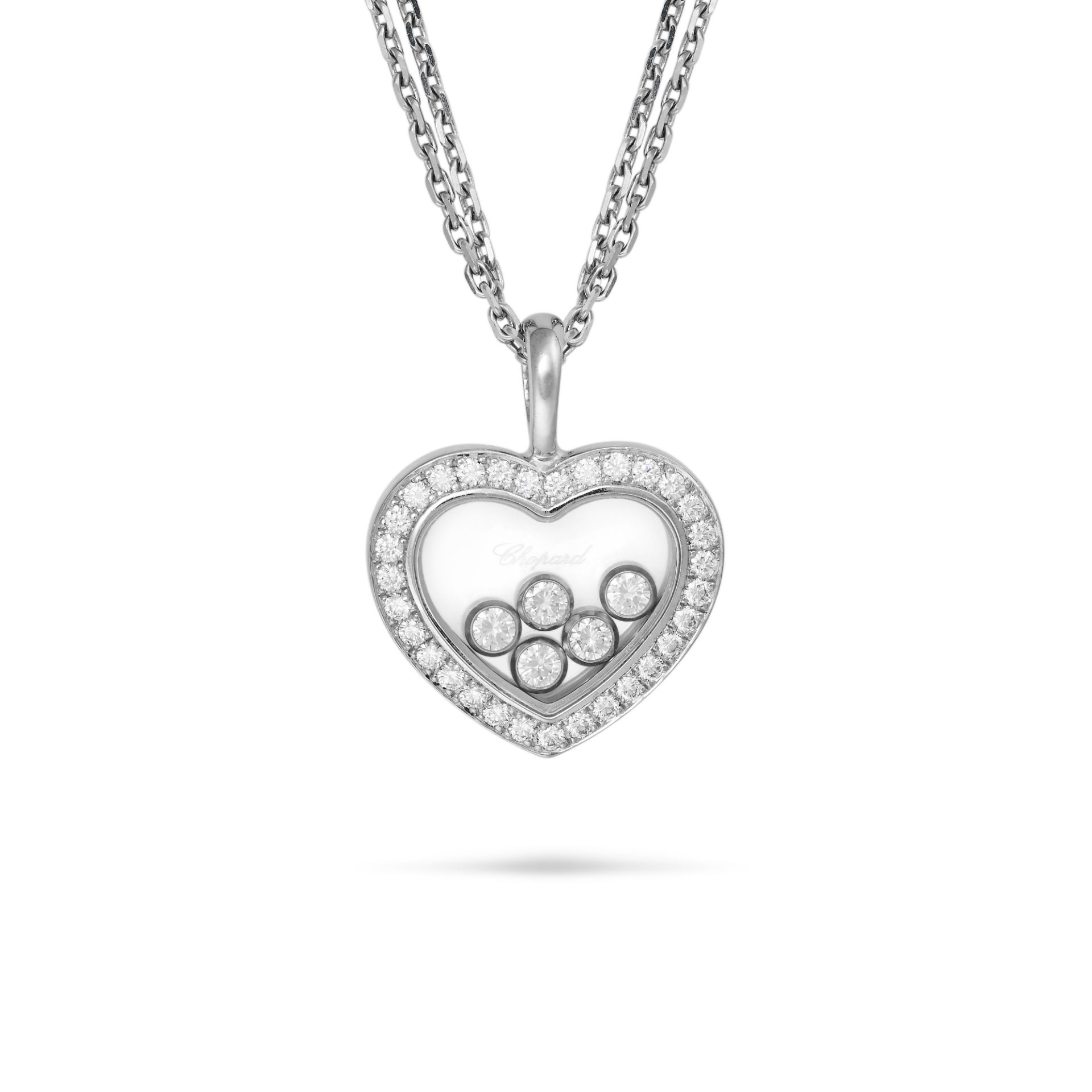 CHOPARD, A HAPPY DIAMONDS HEART NECKLACE the pendant comprising five free moving round brilliant ...