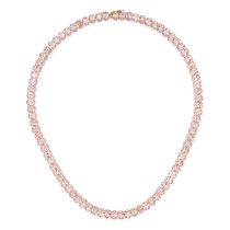 A MORGANITE LINE NECKLACE comprising a row of oval cut morganites, the morganites all totalling 5...