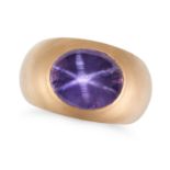 A PURPLE STAR SAPPHIRE RING set with an oval cabochon purple star sapphire of approximately 15.54...