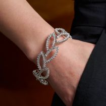 ANGELA CUMMINGS, A DIAMOND LEAF BRACELET, 2000 comprising a row of stylised links designed as lea...