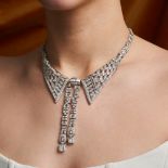 A FINE DIAMOND COLLAR LAVALIER NECKLACE the necklace designed as a stylised collar set with trans...