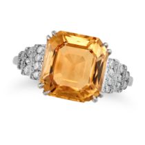 A TOPAZ AND DIAMOND RING set with an octagonal step cut imperial topaz of approximately 4.70 cara...