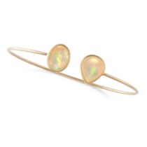 AN OPAL BANGLE designed as an open cuff terminated at each end with an oval and a pear shaped cab...