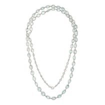 AN AQUAMARINE SAUTOIR NECKLACE comprising a single row of graduated oval cut aquamarines and one ...