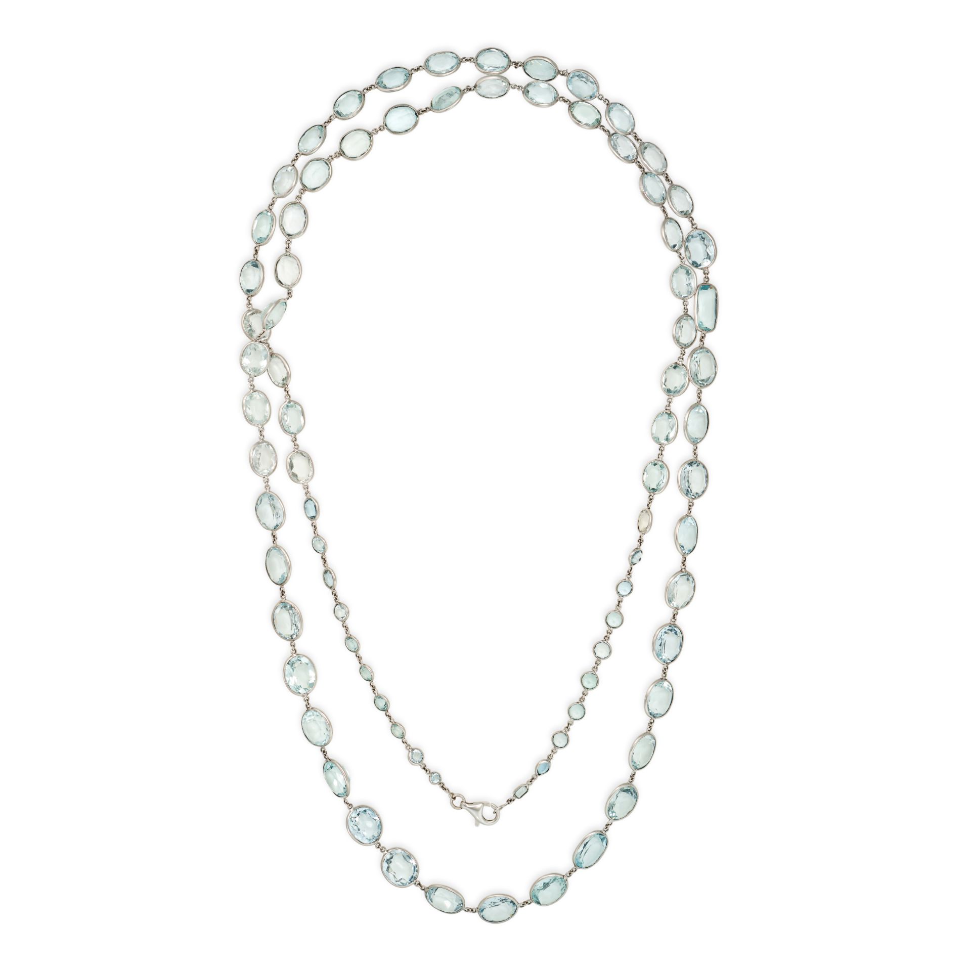 AN AQUAMARINE SAUTOIR NECKLACE comprising a single row of graduated oval cut aquamarines and one ...