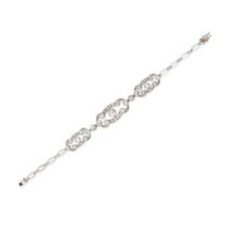 A DIAMOND BRACELET comprising three openwork plaques set throughout with old and rose cut diamond...