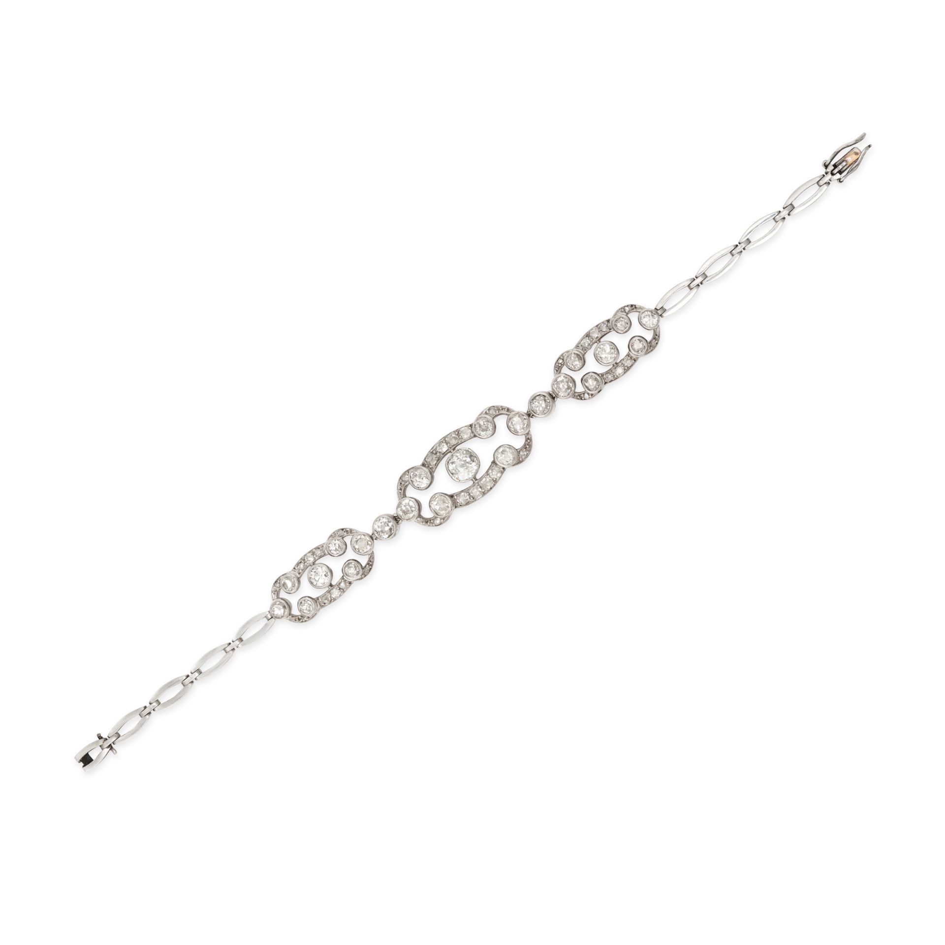 A DIAMOND BRACELET comprising three openwork plaques set throughout with old and rose cut diamond...