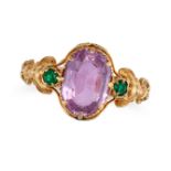 A PINK TOPAZ AND EMERALD RING set with an oval cut pink topaz of approximately 2.17 carats accent...