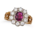 A RUBY AND DIAMOND CLUSTER RING set with a cushion cut ruby of approximately 0.96 carats in a clu...
