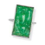A JADEITE JADE RING in silver, set with a rectangular carved jadeite jade, no assay marks, size M...