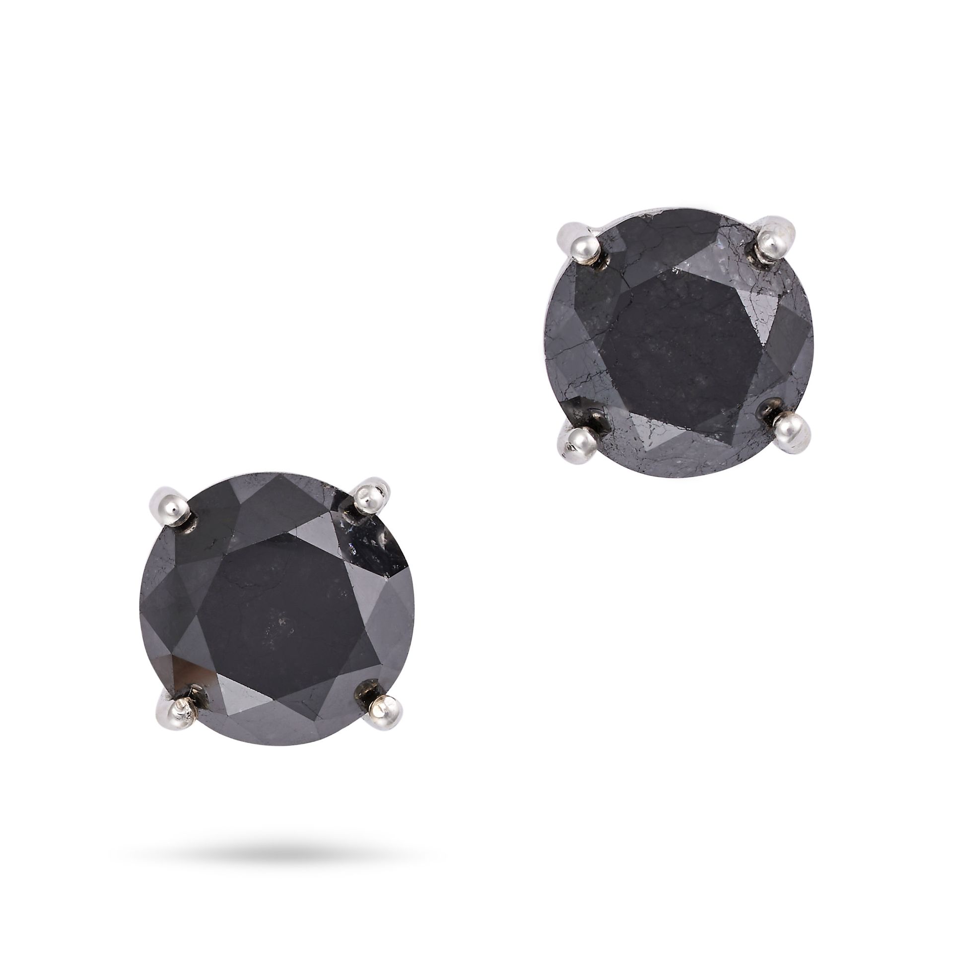 A PAIR OF BLACK DIAMOND STUD EARRINGS each set with a round cut black diamond, no assay marks, 0....