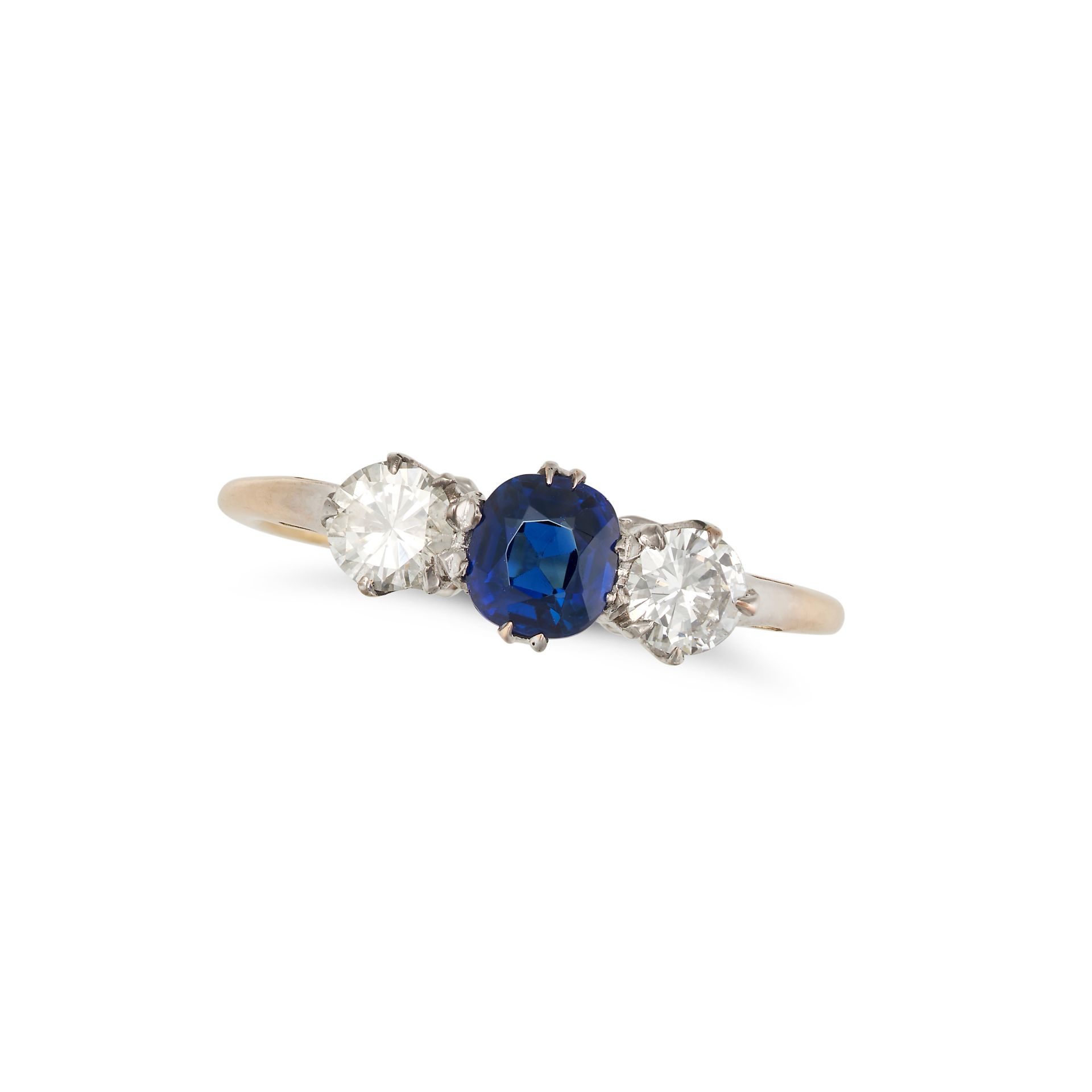 A SAPPHIRE AND DIAMOND THREE STONE RING set with a cushion cut sapphire between two round brillia...