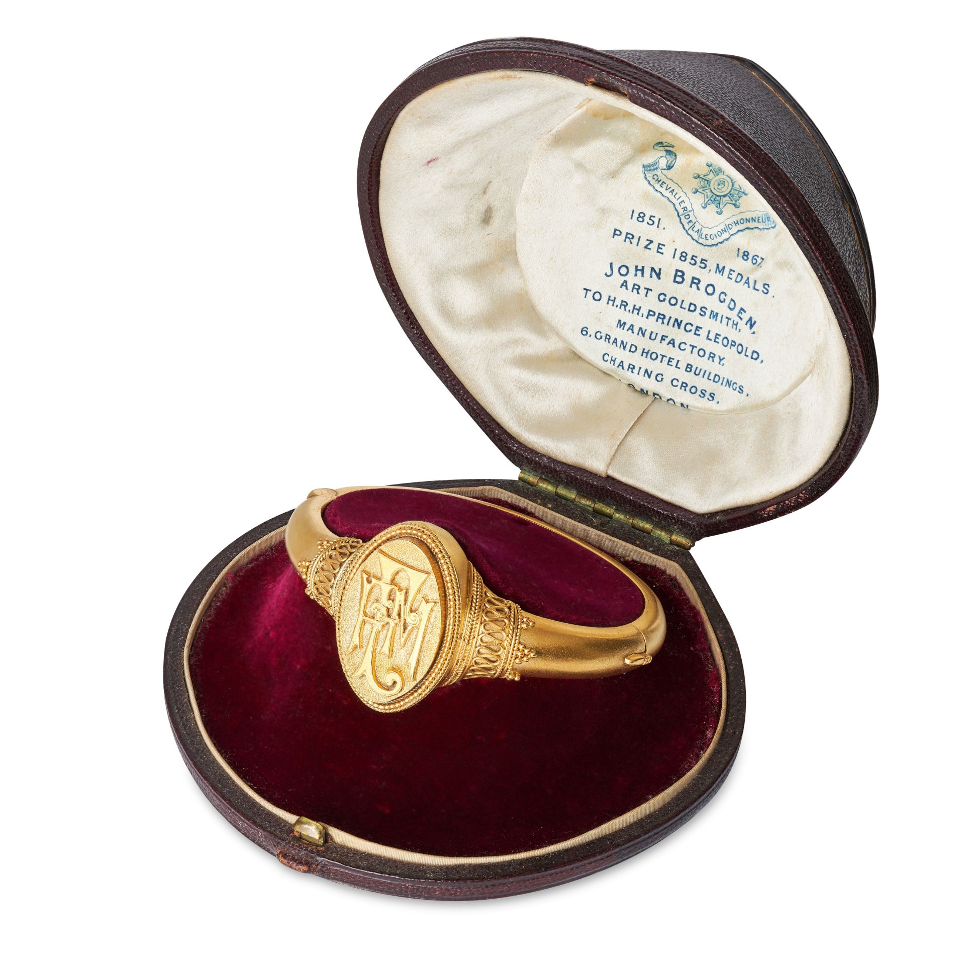 JOHN BROGDEN, AN ANTIQUE VICTORIAN BANGLE in silver gilt, the hinged bangle with an oval face and...