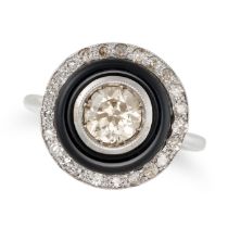 A DIAMOND AND ONYX TARGET RING in 18ct white gold, set with a round brilliant cut diamond of appr...