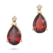 A PAIR OF GARNET AND DIAMOND EARRINGS each set with a round brilliant cut diamond suspending a pe...