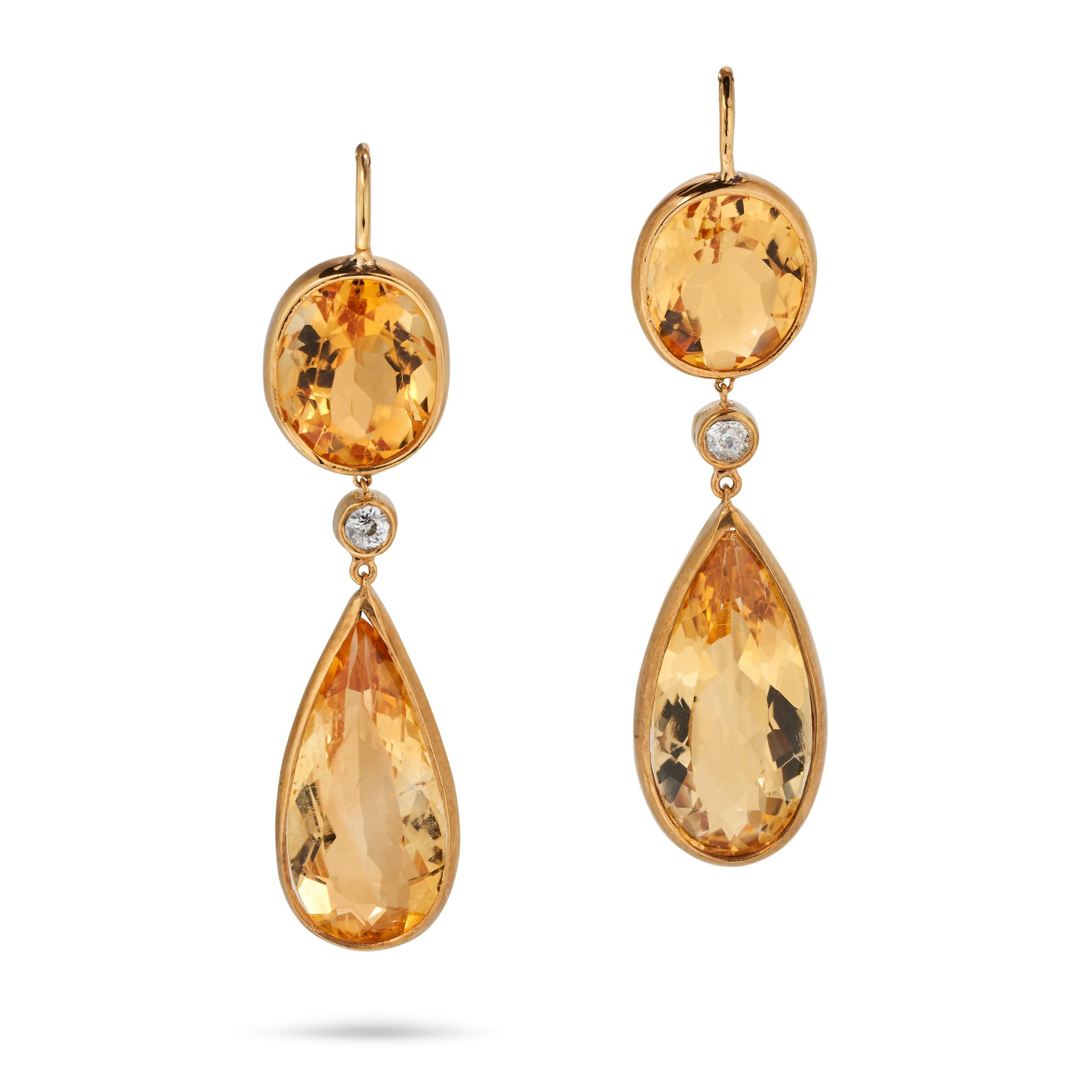 A PAIR OF CITRINE AND DIAMOND DROP EARRINGS each set with an oval cut citrine suspending a round ...
