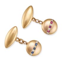 A PAIR OF RUBY, SAPPHIRE AND DIAMOND CUFFLINKS in circular form, one set with a row of alternatin...