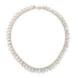 NO RESERVE - A MOONSTONE FRINGE NECKLACE comprising a trace chain suspending a fringe of oval cab...
