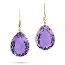 A PAIR OF AMETHYST DROP EARRINGS each set with a pear cut amethyst, stamped 18K, 4.5cm, 10.9g.