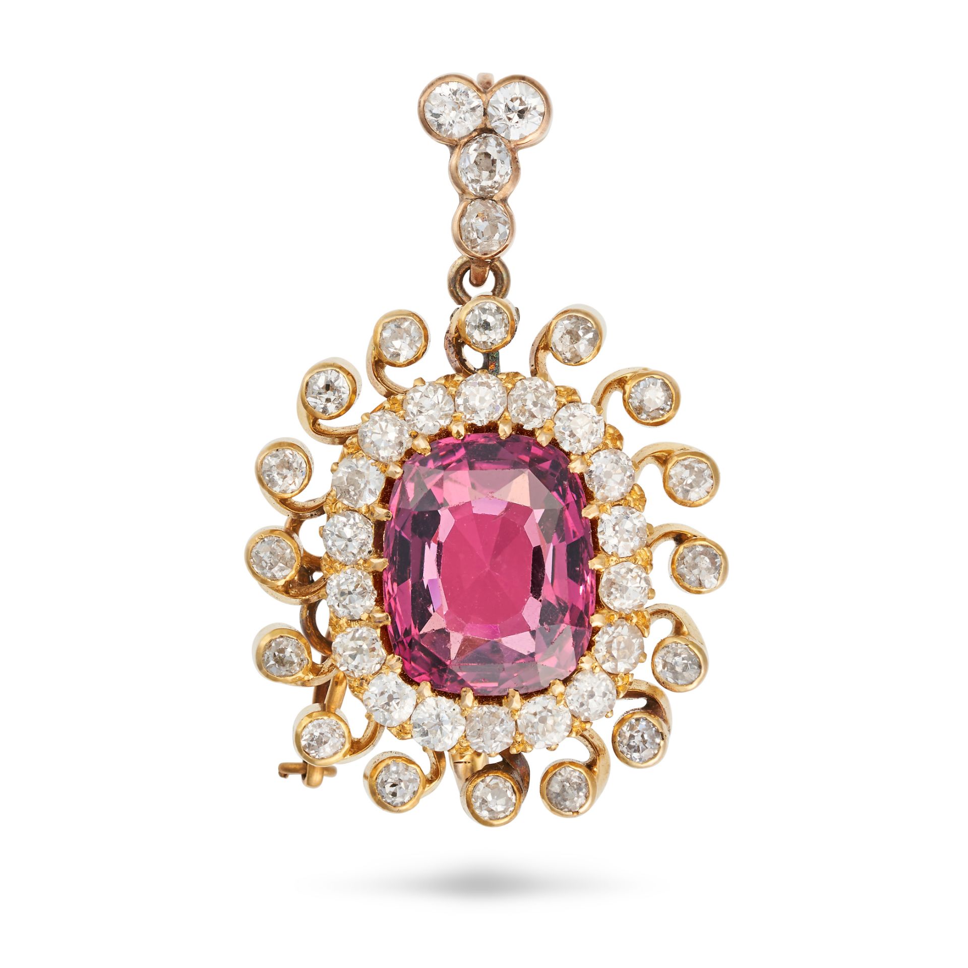 AN ANTIQUE GARNET DIAMOND BROOCH / PENDANT in yellow gold, set with a cushion cut garnet in a clu...