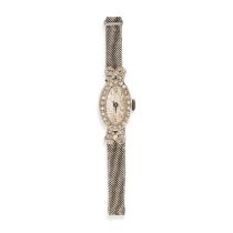 NO RESERVE - AN ANTIQUE DIAMOND WRISTWATCH the oval face with Arabic numerals in a border of roun...